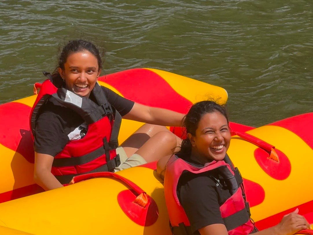 Laughing on a river tube with a friend